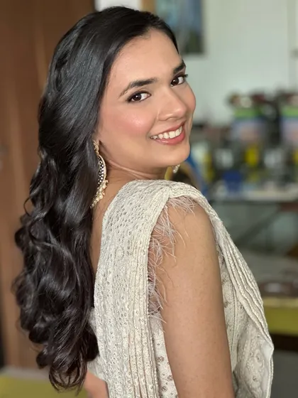 Subtle makeup glam for this beauty. A simple, clean look that lets her natural radiance shine through.