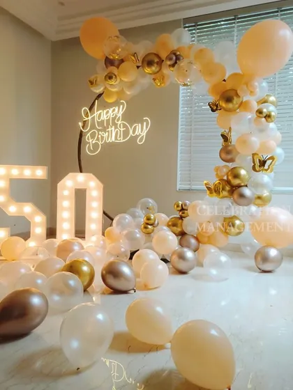 This elegant and warm setup is the perfect way to honor a 50th birthday and create lasting memories.