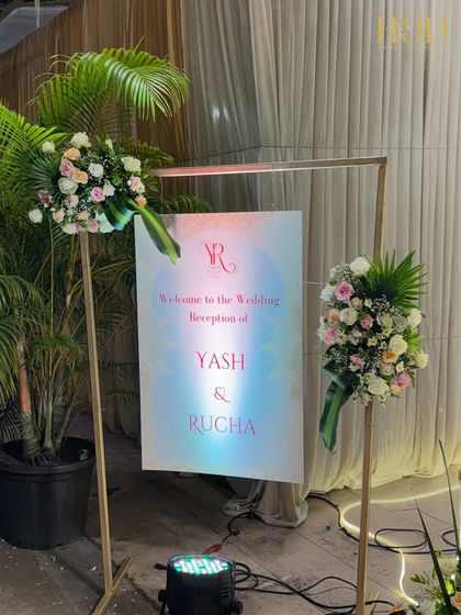 The modern welcome sign against a draped backdrop, showing how a simple design can be incredibly elegant and effective.