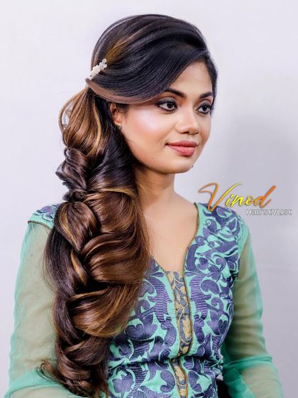 A dramatic one-sided braid with lots of volume and texture, perfect for making a statement.