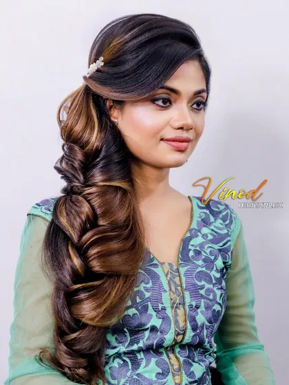 A dramatic one-sided braid with lots of volume and texture, perfect for making a statement.