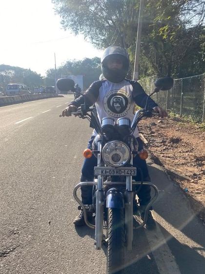 A graduate on the open road, wearing her Heels on Wheels shirt with pride. This is the freedom our training unlocks.