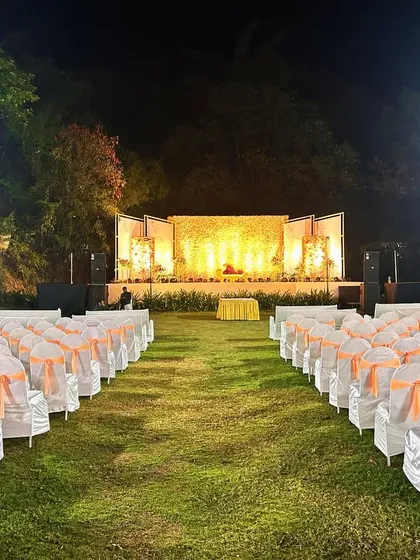 The full view of the reception area, showing the stage in context with the guest seating, creating a cohesive and elegant event space.