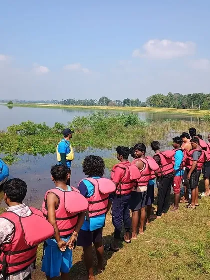 A group of students lines up on the shore for a safety briefing before starting their practical sessions in Ambigarahalli.