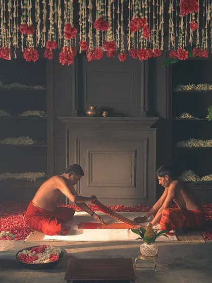 The journey of the saree begins with the weavers. This scene shows the ritualistic folding of the Kanjivaram, a crucial part of the story we told for Kanakavalli.