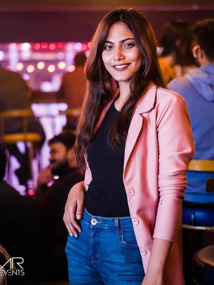 A guest posing at the bar.