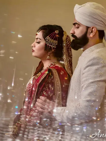 An ethereal portrait of a couple with their eyes closed, surrounded by a prism of light. This creative effect gives the image a dreamy, spiritual quality.