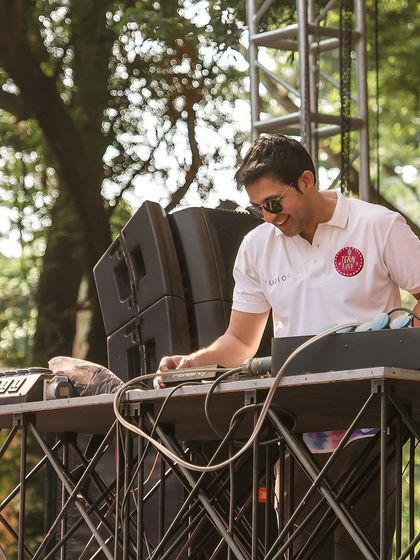 A candid moment at the console during the Holi party.