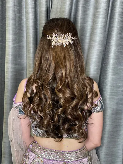 The back view of this elegant engagement hairstyle. The accessory is placed perfectly to catch the light.