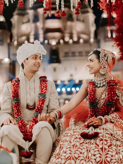 A candid moment of connection between the bride and groom during their wedding ceremony. While we manage the grand logistics, we never lose sight of the personal, human story at the heart of it all.