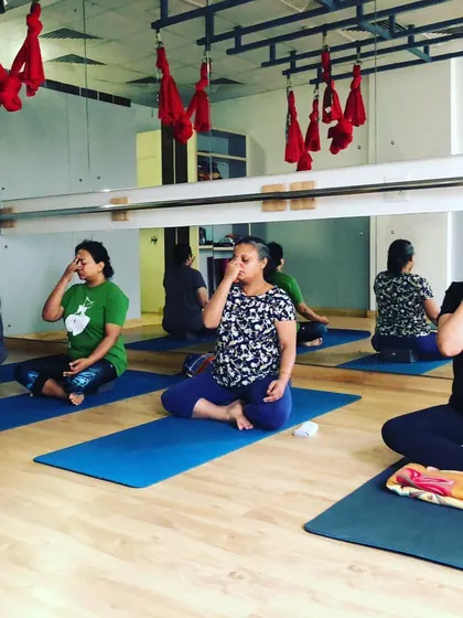 Here, my students are practicing Nadi Shodhana, or alternate nostril breathing, a powerful pranayama technique. This practice is wonderful for calming the nervous system, reducing anxiety, and balancing the body's energy. It is a core part of the therapeutic yoga I teach in my studio.