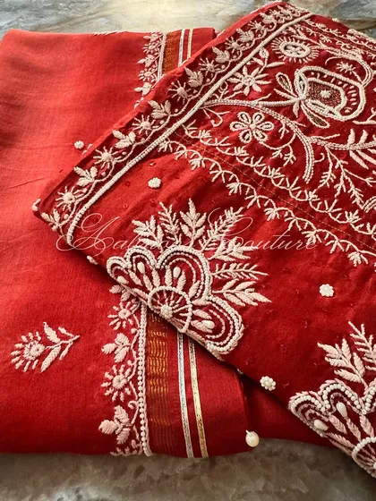 A detail shot of the sleeve and lower part of the kurta, showing the continuity of the embroidery.