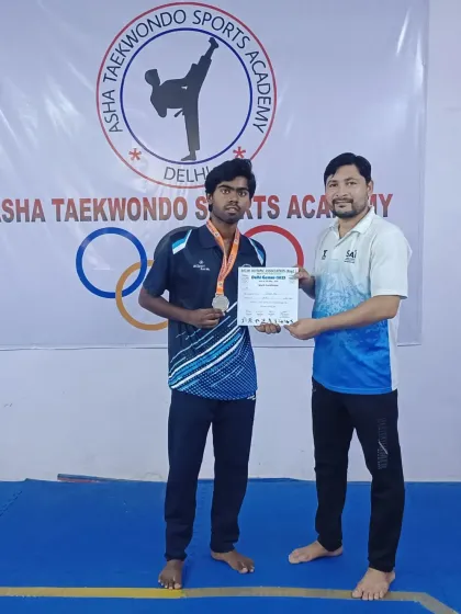 This student earned a silver medal at the Delhi Games, showcasing great skill and sportsmanship. Every medal is a victory for Team ASHA.