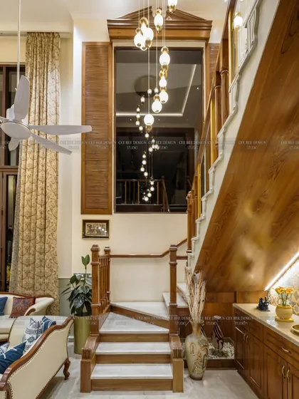 I obsess over details that make a home unique, like this bespoke staircase. Crafted with Italian marble treads and a custom teak wood railing, it’s more than just a functional element; it’s an architectural statement. The cascading pendant lights add a final touch of drama and elegance.