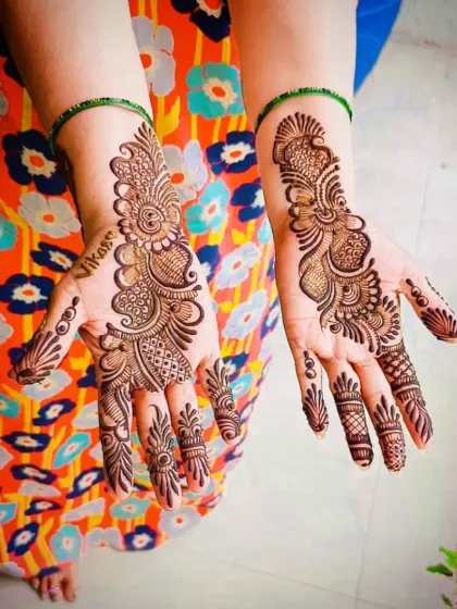 A delicate Arabic design with a personalized touch, incorporating the name "Vikas" into the flowing vine.
