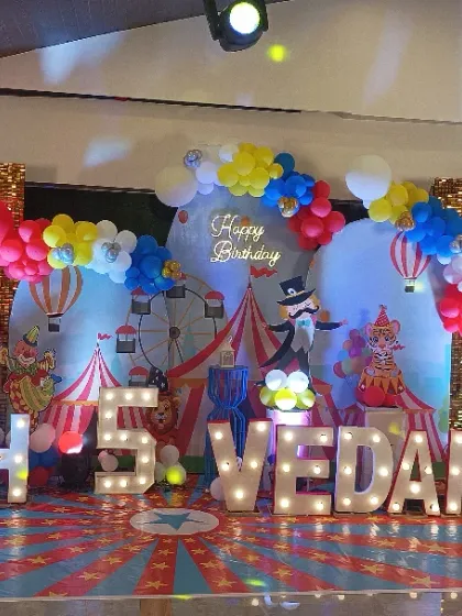 Step right up to the greatest birthday on Earth with this vibrant Carnival theme. I used a classic red, yellow, and blue color palette, a gold shimmer wall, fun character cutouts, and marquee letters to create a festive circus atmosphere for a memorable 5th birthday party.