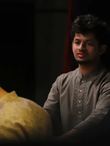 A moment of intense listening while accompanying a santoor recital. My role in sangat is to anticipate and complement the melodic artist's phrasing.