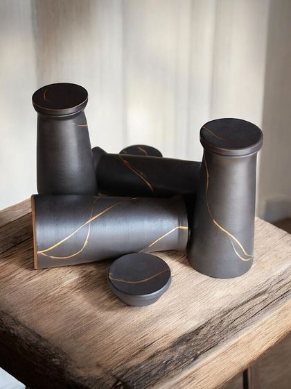 These lidded carafes are both functional and beautiful, designed to enhance the coffee tasting experience. It's rewarding to see my work become part of a local business's story.