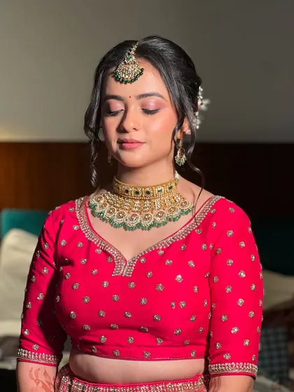 A serene moment with eyes closed, showing the soft, blended eyeshadow and flawless skin.