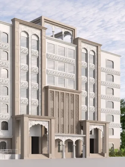 A detailed view of the NRI Niwas at Patna Sahib Gurudwara, showcasing the intricate facade work. Our design respects the sanctity of the space by incorporating traditional motifs and arches into a functional, modern structure for visitors.