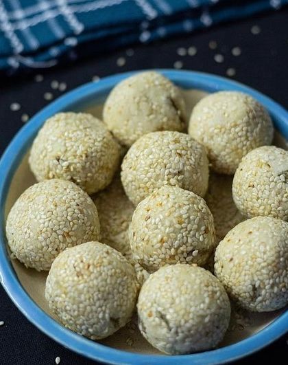 A plate of our delicious Til ke Laddu, made with sesame seeds and jaggery. A healthy and traditional sweet for the winter season.