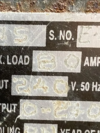 The specification plate of a legacy transformer, showing its 80-ampere max load and 240-volt input. We teach the technical specifications that are crucial for safe and effective power distribution on set.
