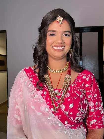 Another portrait of Ayushi's reception look. The makeup is designed to be both beautiful in person and stunning in photos, with a focus on a flawless, long-lasting base.