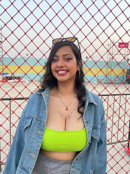 Another view of the delicate chest glitter art. It's a beautiful way to add a touch of festival magic.