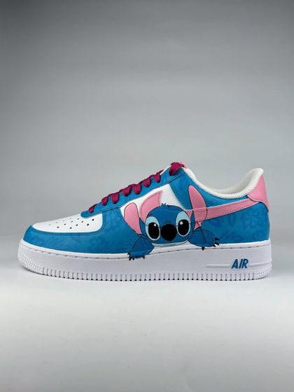 A side profile of the Stitch custom sneaker, showcasing the vibrant blue and pink color scheme.