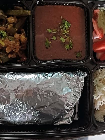 A tasty thali with black chana masala and masala bhindi. A great combination of flavors and textures.