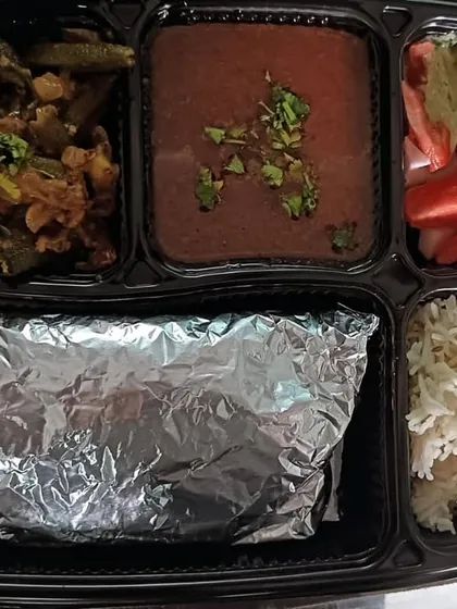 A tasty thali with black chana masala and masala bhindi. A great combination of flavors and textures.