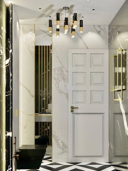 A luxury powder bathroom with a bold black and white theme. The design features marble walls, a geometric tiled floor, and a modern black and gold chandelier.