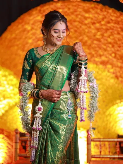 A bride admiring her intricate floral kaliras during her ceremony.