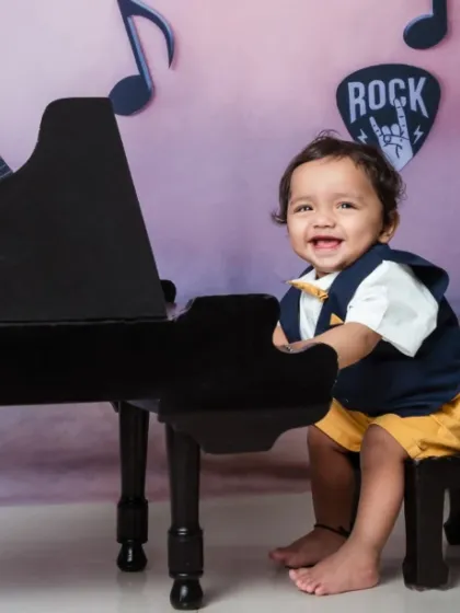 Cuteness is our favorite tune. Our little pianist is ready to perform.