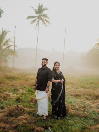 A beautiful portrait of the couple in a misty field. The atmospheric conditions create a dreamy and cinematic feel.