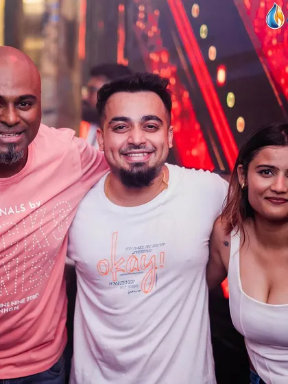 Posing with DJ Milan and a guest.
