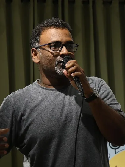A passionate speaker addressing the audience at "Speaking Souls".