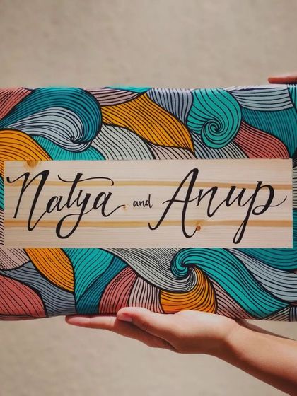 A duplicate of 167, we love how this boho-inspired name plaque for "Natya and Anup" turned out. The natural wood grain contrasts beautifully with the colorful, intricate line art.