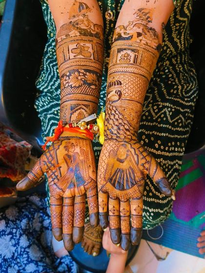 A beautiful bridal design with portraits on both palms. One hand shows the bride, and the other shows a scene from the wedding ceremony.