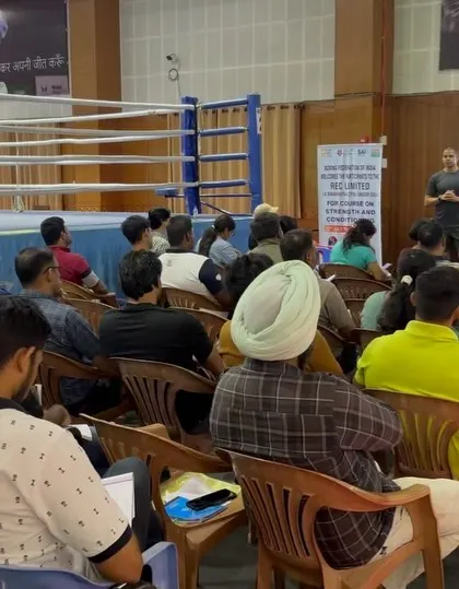 Presenting in front of a boxing ring. The context of the sport is always front and center in my workshops.