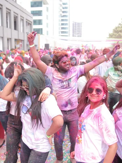 The energy of the dance floor at a corporate Holi party. Employees are seen dancing and enjoying themselves, showcasing the lively entertainment and atmosphere we curate.