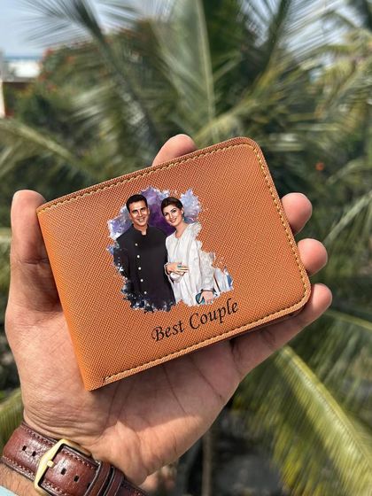 A close-up of the tan Saffiona wallet, printed with a "Best Couple" photo. The artistic splash of color in the background makes the photo pop.