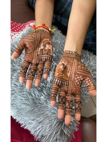 A classic groom mehendi design featuring portraits of the bride and groom, each framed like a royal painting. This style is perfect for grooms who want a traditional yet personalized touch, symbolizing the bond they are about to form.