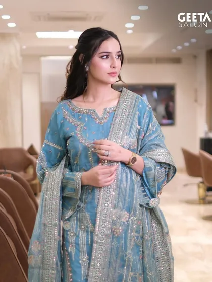 The complete look for Sadia Khateeb, showcasing the beautiful blue ethnic wear. Her half-up, half-down hairstyle is elegant and keeps the focus on the detailed outfit and makeup.