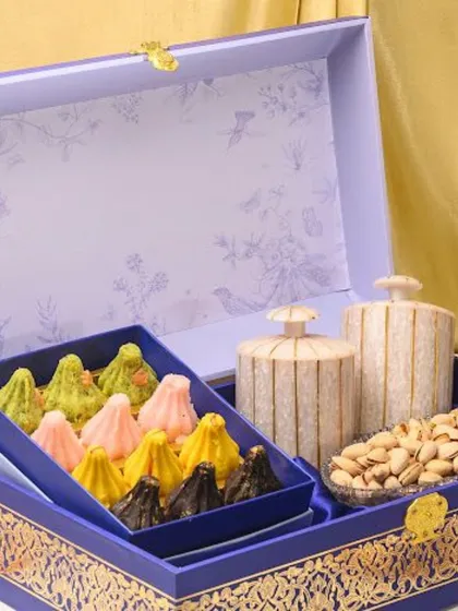 My gourmet modaks are a tribute to tradition, handcrafted for Ganesh Chaturthi. I use the finest ingredients to create these delicate sweets, presented in a royal blue and gold box that is as special as the offering itself.