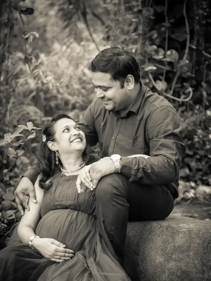 A happy, candid moment captured in black and white. The lack of color draws all the attention to the couple's joyful expressions.