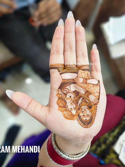 A beautiful portrait of Lord Shiva and Parvati, perfect for a bride who wants to incorporate spiritual elements into her mehndi.