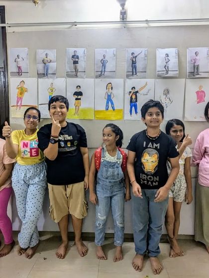 Thumbs up for a great figure drawing session! Our weekend art class students are happy with the work they produced, which is now displayed on the wall.