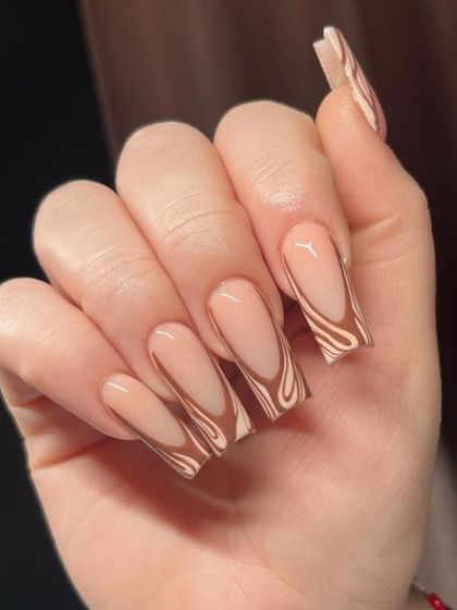 A trendy 'latte swirl' design on long coffin nails, with abstract brown and nude patterns for a chic, modern look.