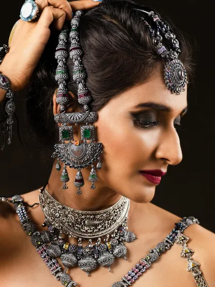 For this jewellery campaign, the focus was on creating a dramatic, high-fashion look. I used a dark, intense smokey eye and a deep berry lip to complement the intricate details of the oxidised silver jewellery, making the entire look camera-ready and impactful.